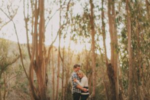 Montana De Oro engagement photo of a couple in the eucalyptus trees