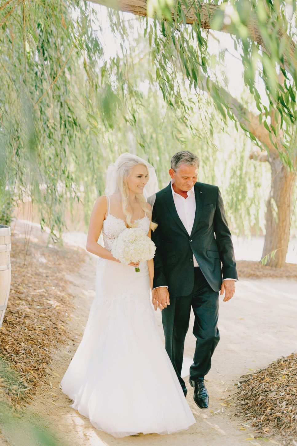 Bride and Father walking down aisle at a Terra Mia Fall Wedding