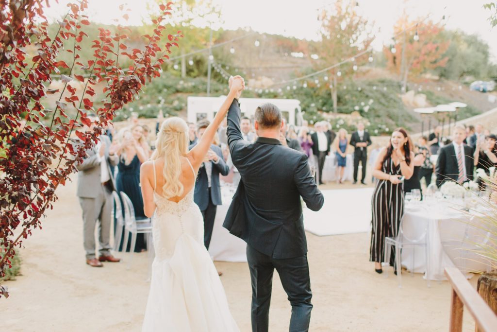 grand entrance of bride and groom at a Terra Mia Fall Wedding