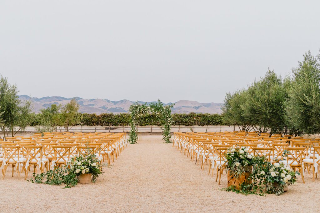 Adornment Flowers floral arrangement at a Biddle Ranch Vineyards Wedding by Jake and Necia Photography