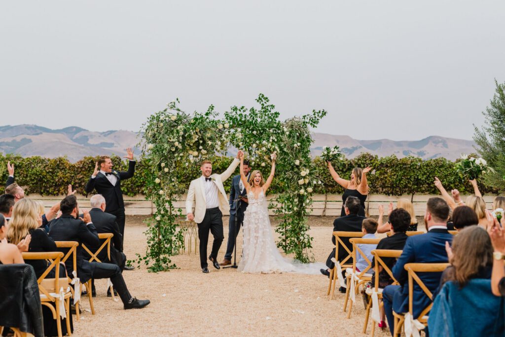 Wedding guests shout Mazal Tov to a bride and groom at Biddle Ranch Vineyards Wedding