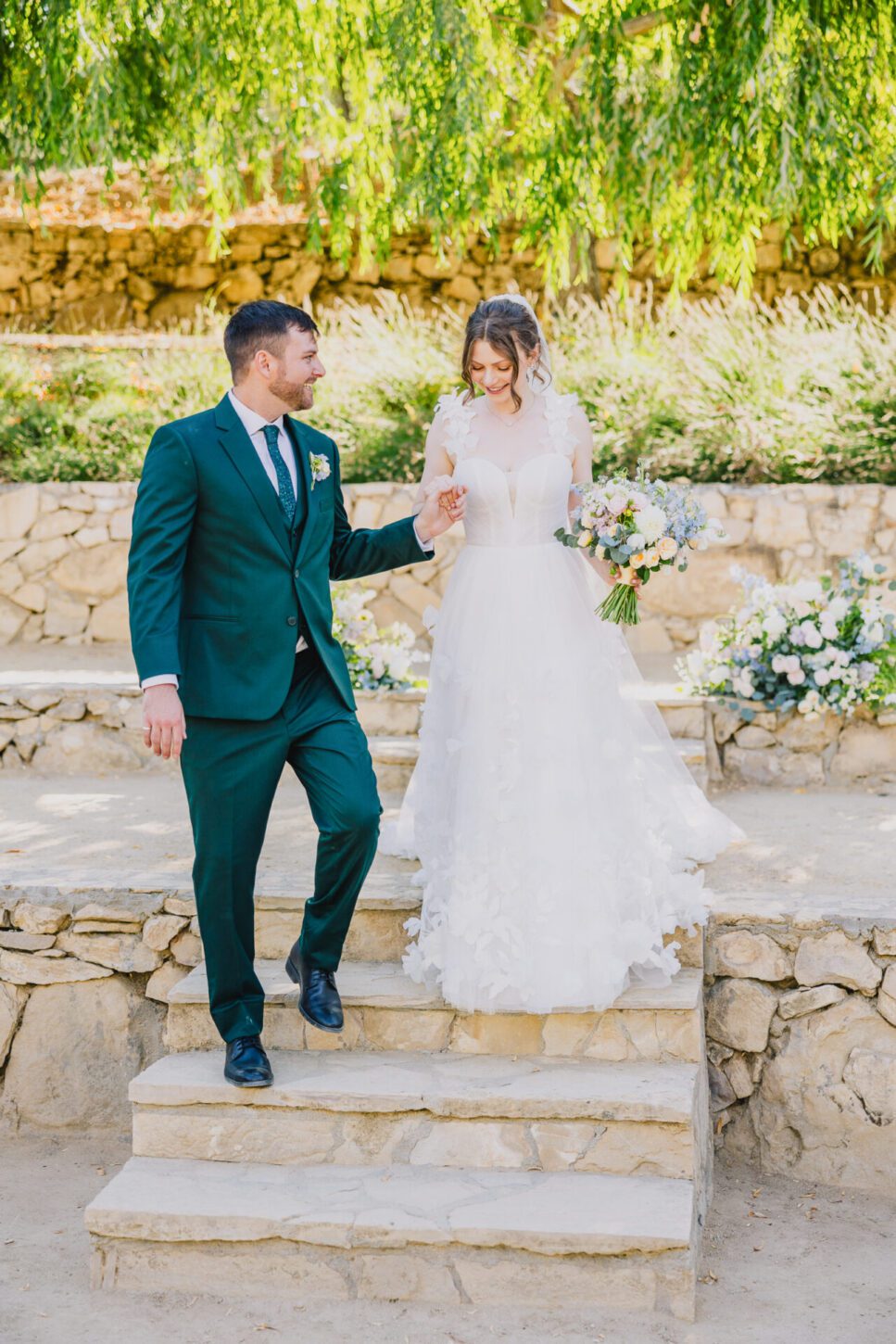 Bride and Groom walk together at a terra mia summer wedding