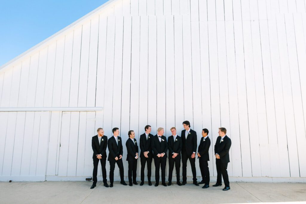 a groom and his groomsman at The White Barn